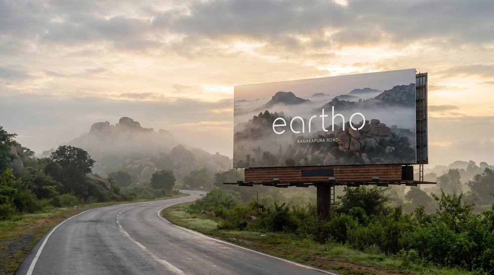 Eartho billboard on a road through the hills